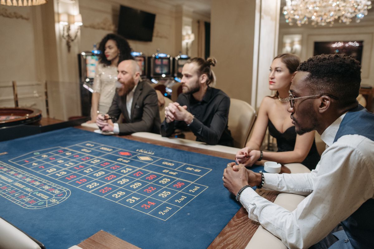 a group of people sitting at a gaming table